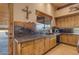 Kitchen features wood cabinets, granite counters and a sink at 32905 N 140Th St, Scottsdale, AZ 85262