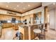 Open kitchen features wood cabinets, granite counters & island at 32905 N 140Th St, Scottsdale, AZ 85262