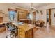 Rustic-style home office with a large wooden desk and built-in cabinets at 32905 N 140Th St, Scottsdale, AZ 85262