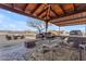 Outdoor kitchen and dining area with mountain views at 32905 N 140Th St, Scottsdale, AZ 85262