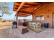 Outdoor kitchen and dining area with a rustic charm at 32905 N 140Th St, Scottsdale, AZ 85262