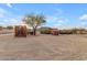 Ranch entrance with red truck and western gate at 32905 N 140Th St, Scottsdale, AZ 85262