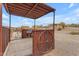 Rustic ranch patio with wooden wheel decoration at 32905 N 140Th St, Scottsdale, AZ 85262