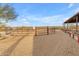 Round pen for horses with wooden benches nearby at 32905 N 140Th St, Scottsdale, AZ 85262