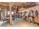 Rustic tack room with numerous saddles and dining area at 32905 N 140Th St, Scottsdale, AZ 85262