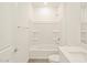 Bright white bathroom with a shower over tub and sleek, modern fixtures at 330 S San Fernando Ln, Casa Grande, AZ 85194