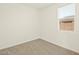 Well-lit bedroom with neutral carpet and a window with horizontal blinds at 330 S San Fernando Ln, Casa Grande, AZ 85194