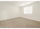 Spacious bedroom with neutral carpet and a window providing natural light at 330 S San Fernando Ln, Casa Grande, AZ 85194