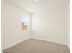 Bright bedroom with neutral carpet and a window providing natural light at 330 S San Fernando Ln, Casa Grande, AZ 85194