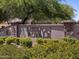 Entrance to the Mission Royale Community with lush greenery and mature trees at 330 S San Fernando Ln, Casa Grande, AZ 85194