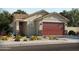 One-story home with brown garage door and desert landscaping at 330 S San Fernando Ln, Casa Grande, AZ 85194