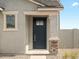 A close-up of the front door shows the lovely desert landscaping at 330 S San Fernando Ln, Casa Grande, AZ 85194