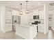 Modern kitchen featuring granite countertops, stainless steel appliances, and white cabinets at 330 S San Fernando Ln, Casa Grande, AZ 85194