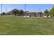 Green grassy park with covered pavilion and playground at 335 S San Fernando Ln, Casa Grande, AZ 85194