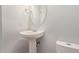 Small bathroom with pedestal sink and toilet at 34619 N 30Th Ave, Phoenix, AZ 85086