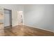 Bright bedroom with wood-look floors and mirrored closet doors at 34619 N 30Th Ave, Phoenix, AZ 85086