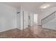 Ground floor entryway with tile floor and staircase at 34619 N 30Th Ave, Phoenix, AZ 85086