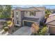 Two-story house with a green garage door and tile roof at 3617 E Half Hitch Pl, Phoenix, AZ 85050