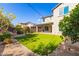 Artificial turf backyard with fire pit and string lights at 3617 E Half Hitch Pl, Phoenix, AZ 85050