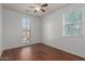 Well-lit bedroom with hardwood floors and large window at 3617 E Half Hitch Pl, Phoenix, AZ 85050