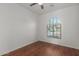 Bright bedroom featuring hardwood floors and an arched window at 3617 E Half Hitch Pl, Phoenix, AZ 85050