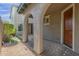 Brick paved courtyard with arched entryways and desert plants at 3617 E Half Hitch Pl, Phoenix, AZ 85050