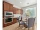 Kitchen nook with built in desk and window seating at 3617 E Half Hitch Pl, Phoenix, AZ 85050