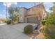 Two-story house with a green garage door and mature trees at 3617 E Half Hitch Pl, Phoenix, AZ 85050