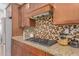 Kitchen detail showing cooktop and granite countertop at 3617 E Half Hitch Pl, Phoenix, AZ 85050