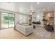 Open living room featuring a stone accent wall and backyard view at 3617 E Half Hitch Pl, Phoenix, AZ 85050