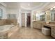 Spa-like bathroom with soaking tub and double vanity at 37 W Sierra Vista Dr, Phoenix, AZ 85013