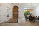 Elegant entryway with wood door, tile floor, and dining area at 37 W Sierra Vista Dr, Phoenix, AZ 85013