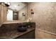 Stylish powder room with vessel sink and unique wallcovering at 37 W Sierra Vista Dr, Phoenix, AZ 85013