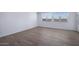 Well-lit bedroom with tile floors and multiple windows at 4120 E Ghost Flower Ln, San Tan Valley, AZ 85140