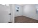 Welcoming entryway with white door, matte black hardware, and wood-look tile flooring at 4120 E Ghost Flower Ln, San Tan Valley, AZ 85140