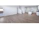 Spacious living area with wood-style tile flooring and open floor plan at 4120 E Ghost Flower Ln, San Tan Valley, AZ 85140