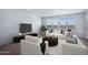 Comfortable living room featuring lots of natural light, plush seating, and elegant decor at 4120 E Ghost Flower Ln, San Tan Valley, AZ 85140