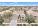 Single-story home with a tile roof and two-car garage at 4229 E Seasons Cir, Gilbert, AZ 85297