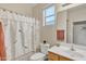 Bathroom with shower/tub combo and wood vanity at 4229 E Seasons Cir, Gilbert, AZ 85297