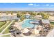 Aerial view of community pool with water features, landscaping, and shade structures at 4229 E Seasons Cir, Gilbert, AZ 85297