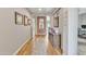 Bright hallway with wood flooring and artwork at 4229 E Seasons Cir, Gilbert, AZ 85297