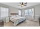 Spacious main bedroom with ceiling fan and window with curtains at 4229 E Seasons Cir, Gilbert, AZ 85297