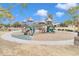 playground with slides, climbing structures, and a sandy play area at 4229 E Seasons Cir, Gilbert, AZ 85297