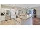 Bright kitchen featuring stainless steel appliances, white cabinetry, and an open breakfast bar at 433 N Neuman Pl, Chandler, AZ 85225