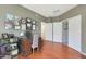 Comfortable home office with a wooden desk and a view of closet with built-in shelves at 433 N Neuman Pl, Chandler, AZ 85225