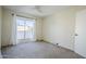 Bright bedroom with carpet flooring and large window at 4701 E Ardmore Rd, Phoenix, AZ 85044