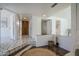 Tiled entryway with wood door and built-in shelving at 4701 E Ardmore Rd, Phoenix, AZ 85044