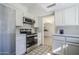 Modern kitchen with stainless steel appliances and white cabinets at 4701 E Ardmore Rd, Phoenix, AZ 85044