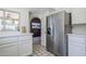 Stainless steel appliances and white cabinetry in kitchen at 4701 E Ardmore Rd, Phoenix, AZ 85044