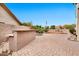 Beautiful brick-paved backyard with built-in BBQ and mature landscaping, perfect for outdoor entertaining at 5010 E Mesquite Wood Ct, Phoenix, AZ 85044